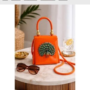 Elegant Orange Mini Bag with Peacock Accent